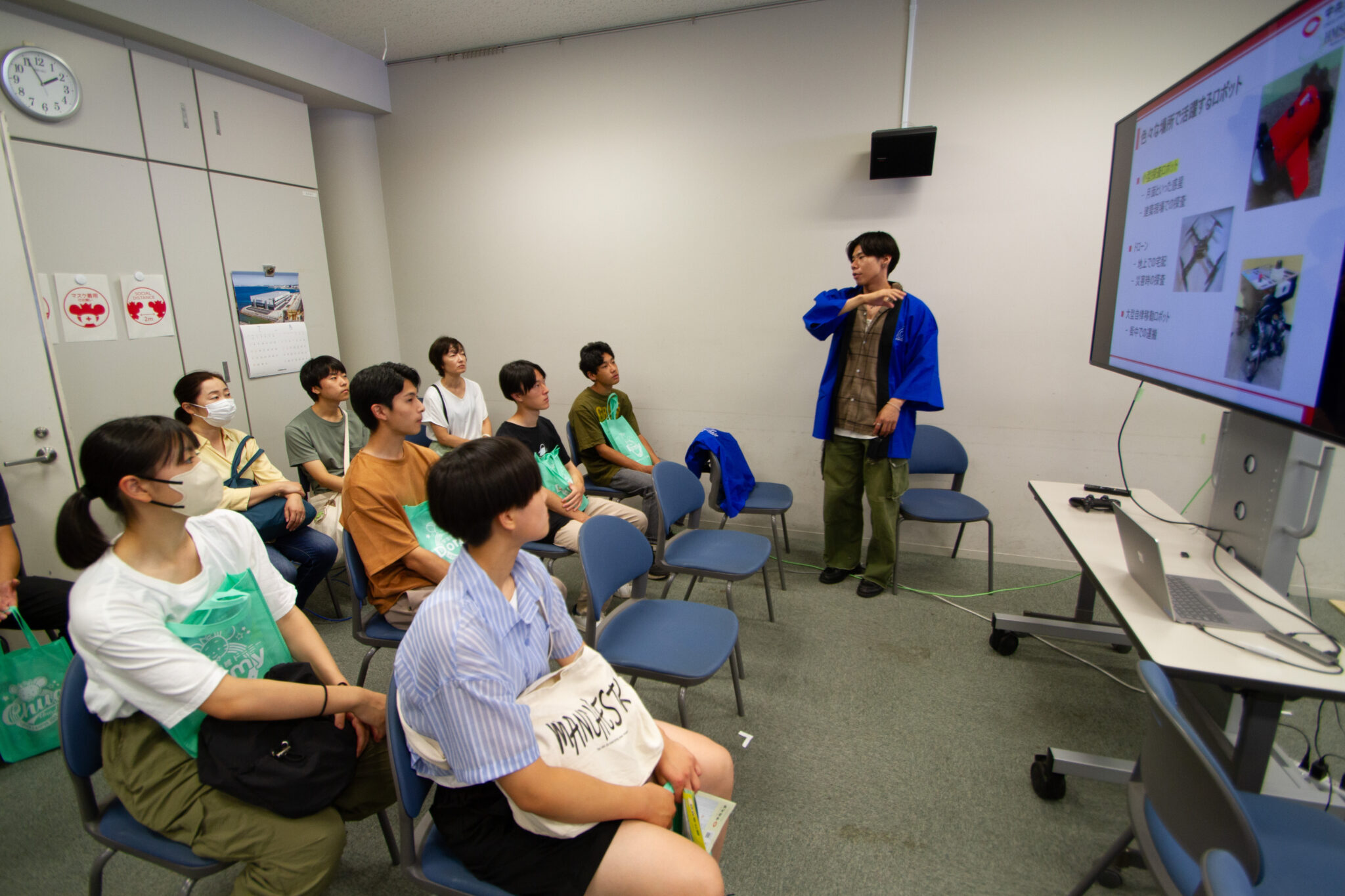Hands-on remote control sessions with swarm robots at the Chuo University Open Campus